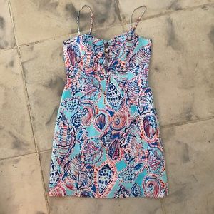 Lilly Pulitzer aqua with blue , pink and red shell designs. Spaghetti strap. Sz4